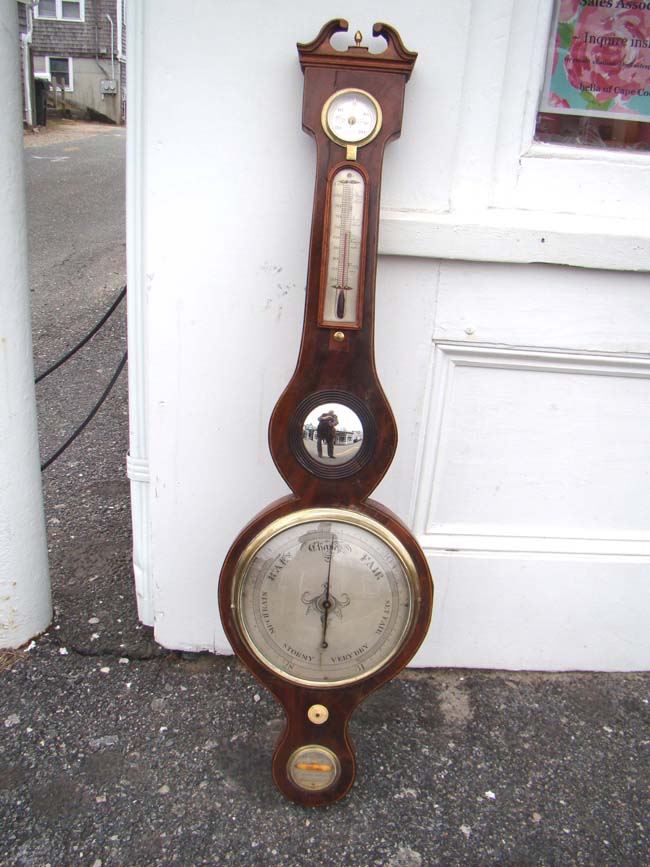 A 19th century mahogany veneered banjo barometer by Anthony Pozzi circa 1830-1850